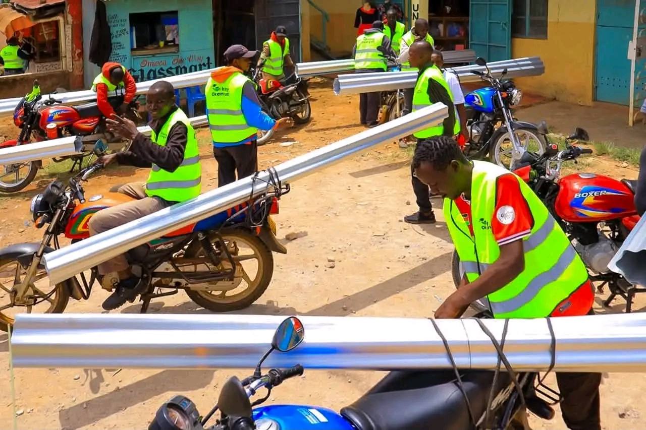 Volunteers preparing iron sheets for delivery